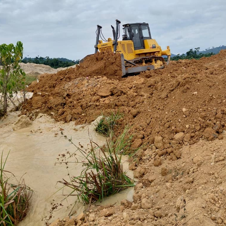 Overgrown pasture cleared back to open grazing area beside rural fencing